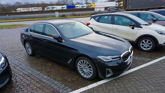 Dortmund, Germany - December 28, 2021: The luxury motor car BMW 520d at Dortmund, Germany on December 28, 2021