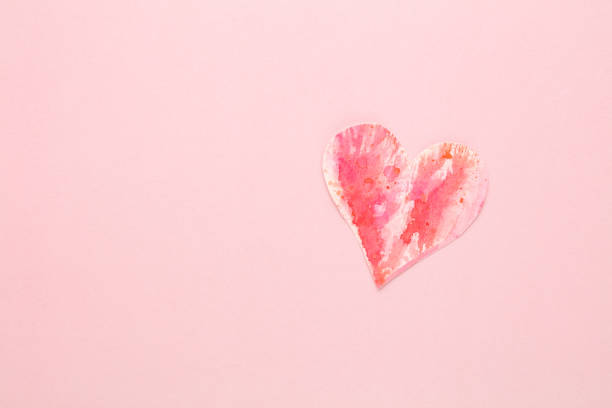 istock Cut the heart shaped paper, put on a pastel background. 1366197128