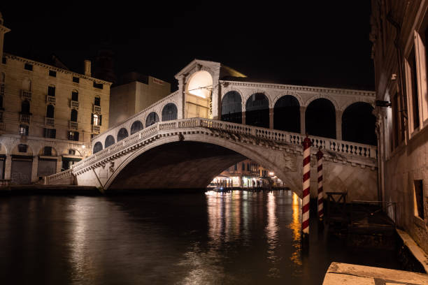 Rialto Bridge or Ponte die Rialto in Venice, Italy, Illuminated at Night
