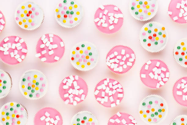 istock Colorful cupcakes on a white background. 1366198852