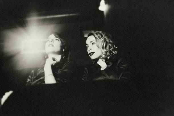 istock Two girlfriends at the cinema. 1366198869