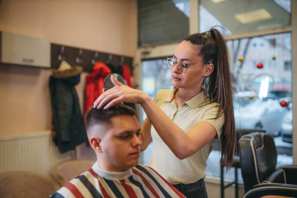 istock A young hairdresser blows a man 1366199238