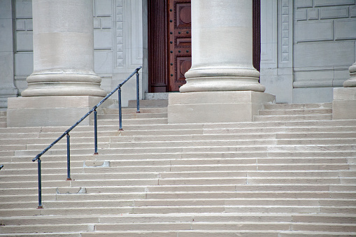stone steps in front of the entrance of a beautiful building