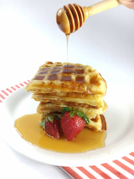 istock Fresh Homemade Delicious Waffle with Honey 1366202243