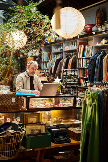 istock vintage shop owner 1366203038