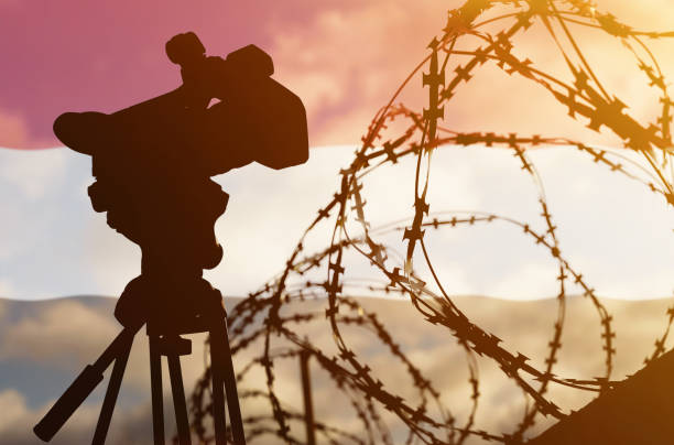Freedom of speech and democracy concept. Double exposure - camera, barbed wire and flag Yemen