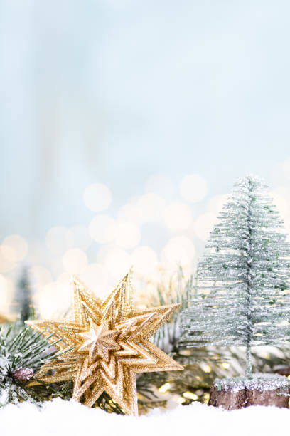istock Christmas ornament with string lights on blue background. 1366209805