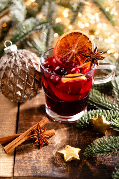 istock Christmas mulled wine with spices on a wooden rustic table. 1366209951