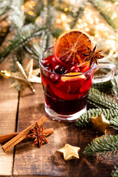 istock Christmas mulled wine with spices on a wooden rustic table. 1366209998