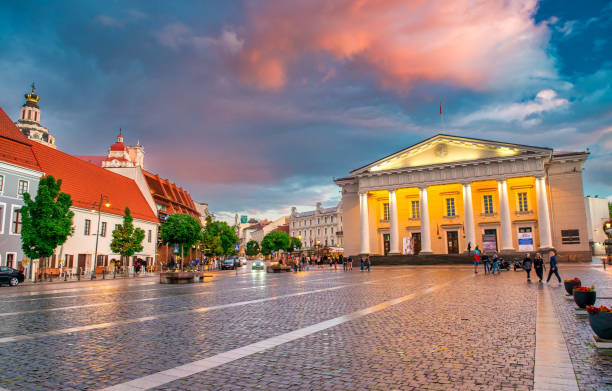 Vilnius, Lithuania - July 9, 2017: Tourists in Town Hall Square at sunset