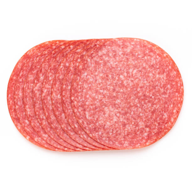 istock Salami slices on white background. 1366213535