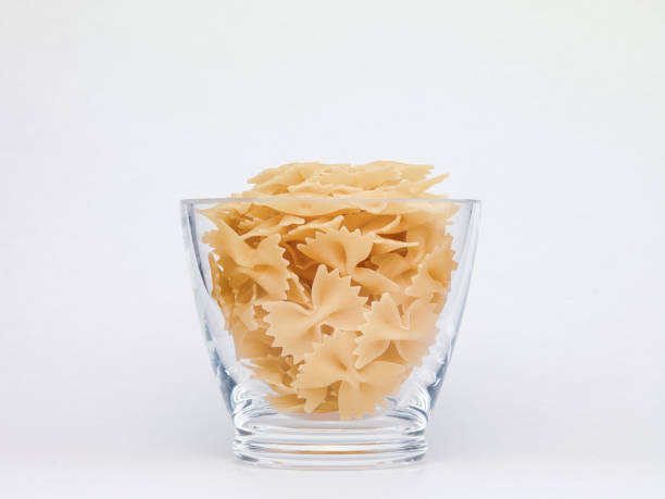 istock Pasta in glass jar on a white background 1366213873