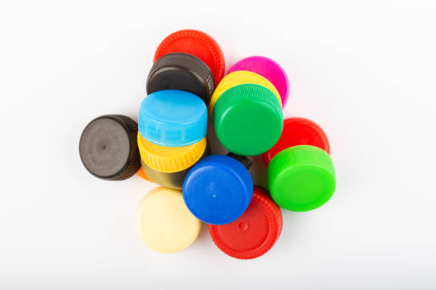istock Pile of colored plastic caps on white background. Recycling concept. 1366214533