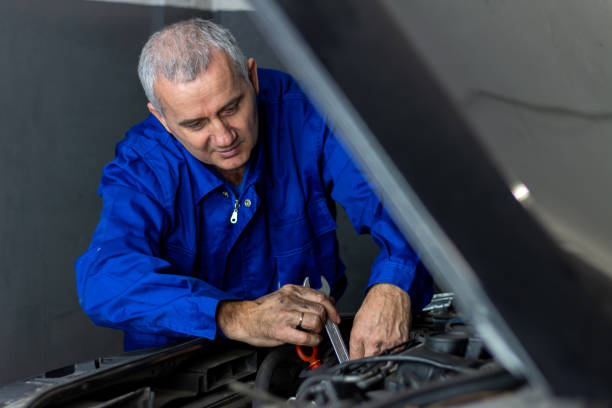 istock Senior experienced mechanic repairing a car at workshop 1366214898