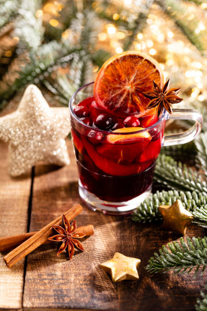 istock Christmas mulled wine with spices on a wooden rustic table. 1366216525