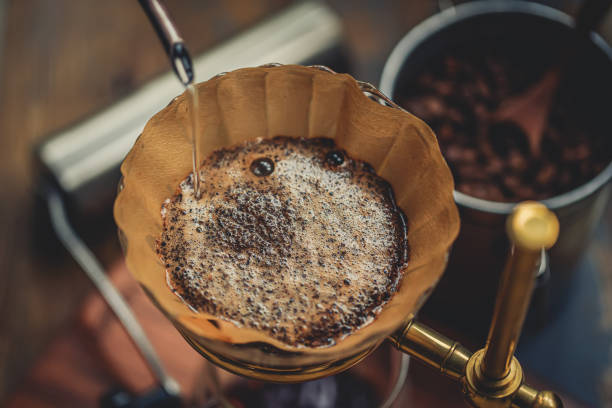 istock Make Pour-over Coffee,Pour Hot Water Into Coffee Powder 1366217409