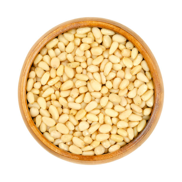 istock Cedar nuts, pine nuts, harvested in Russia, in a wooden bowl 1366218905