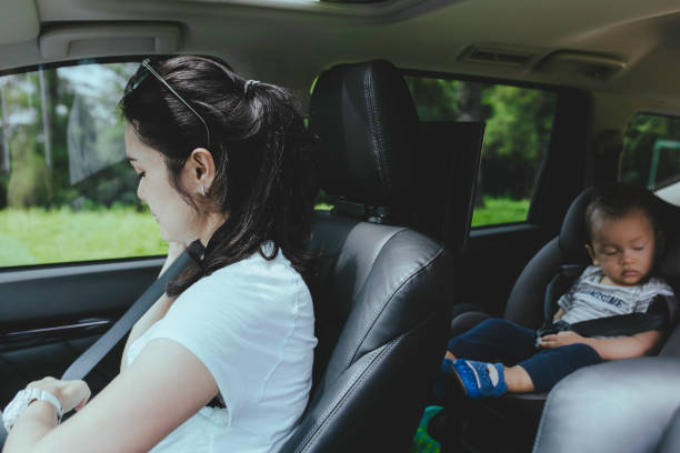 istock mother and baby in car seat 1366219961