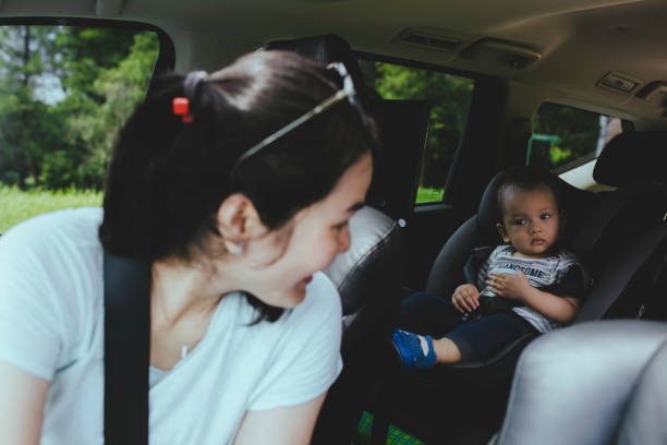 istock mother and baby in car seat 1366219963