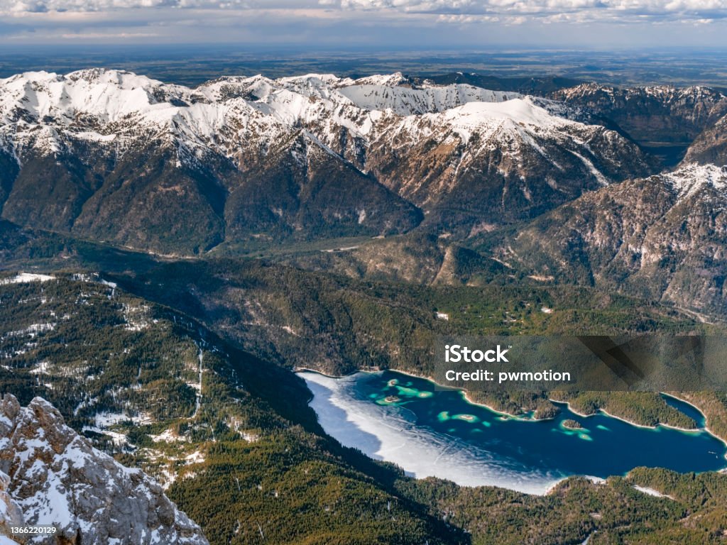 Frozen Eibsee near Garmisch Partenkirchen View from the Zugspitze to the frozen Eibsee, Garmisch Partenkirchen, Bavaria, Germany, Europe Scenics - Nature Stock Photo