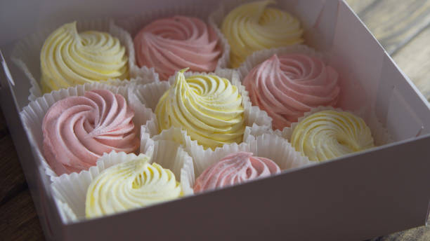 istock Wrapped confection on wooden table. 1366220255