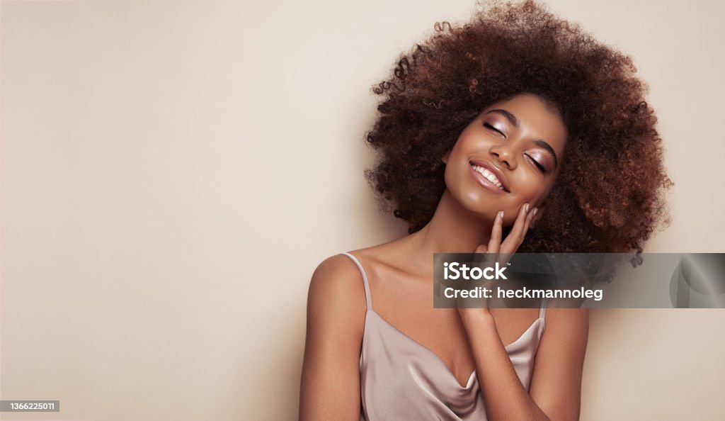 Beauty portrait of African American girl with afro hair Beauty portrait of African American girl with afro hair. Beautiful black woman. Cosmetics, makeup and fashion Women Stock Photo