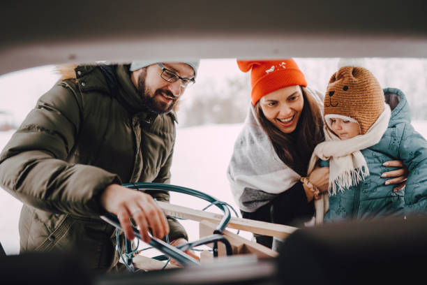 istock Family going to have some fun with sleds on snow 1366225280