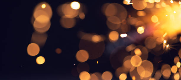 istock background of abstract glitter lights. gold, blue and black 1366226111
