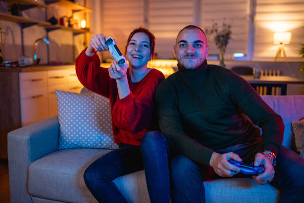 istock Young Couple Playing Video Games 1366226456