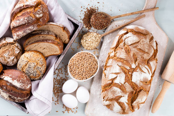 istock Sliced rye bread on cutting board, closeup.. 1366229121