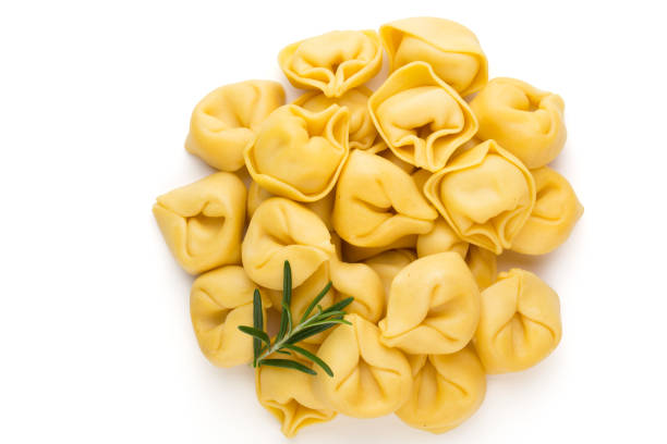 Raw homemade pasta,tortellini with herbs.