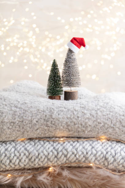 istock Christmas little trees and golden lights bokeh. 1366229297