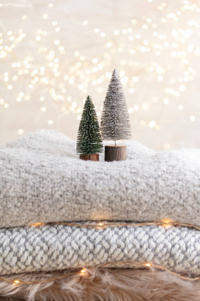 istock Christmas little trees and golden lights bokeh. 1366229313