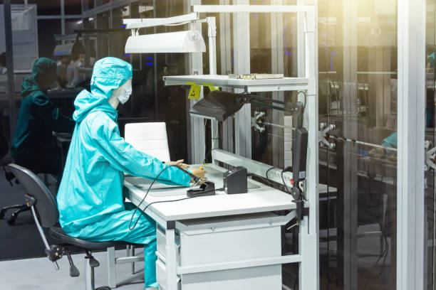 istock A mannequin of a man in a protective suit sits at a computer. 1366229491