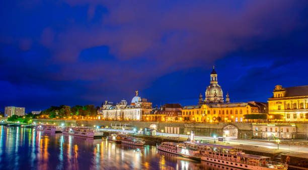 istock Dresden major ancient landmarks along Elbe river at night, Germany. 1366230361