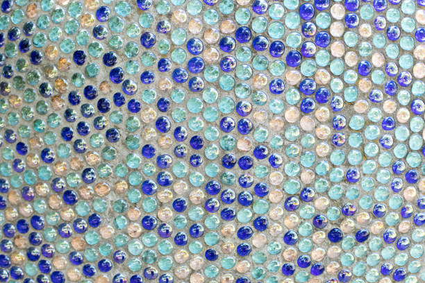 istock Penny round mosaic tiles. Round circle tile. Glass abstract round multicolor mosaic pattern. Mosaic background of round glass blue turquoise balls in wall. Colored mosaic square for background texture 1366231449