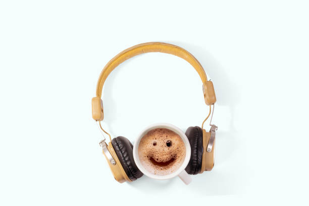 concept earphones and smile coffee frome on white background. stock photo