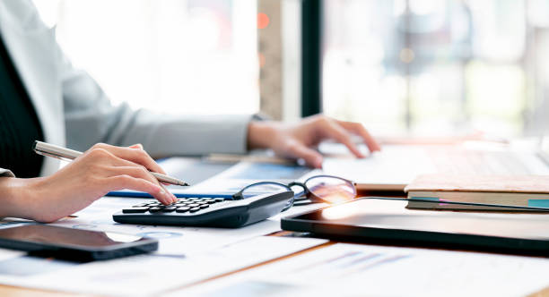 istock Businesswoman working at office with documents on her desk, doing planning analyzing the financial report, business plan investment, finance analysis concept. 1366234782