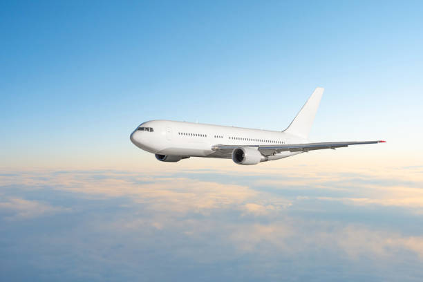 istock Evening flight flying plane in the sky before sunset. 1366235963