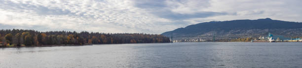istock Panoramic View of Stanley Park during sunny sunset. 1366237810
