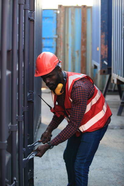 istock African American handsome black engineer he is working in container box yard area of  logistics transportation import export or shipping industry 1366240056