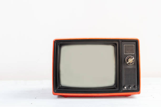 istock Old red television receiver on white table  isolated on white background. Retro, vintage TV  technology style 1366240683