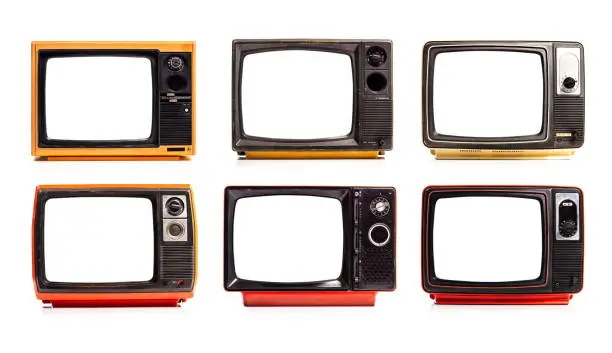 Photo of Collection of retro old television red and yellow with white screens isolated on white background. Six old TV sets