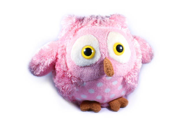istock pink owl doll isolated white 1366241616