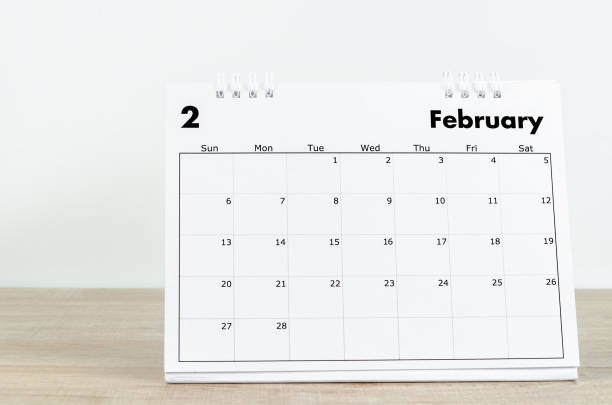 istock February 2022 desk calendar on wooden table. 1366241725