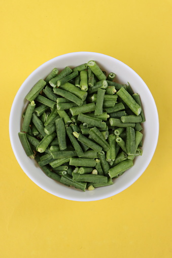 Long bean or sting bean pieces in white bowl, cooking ingredient