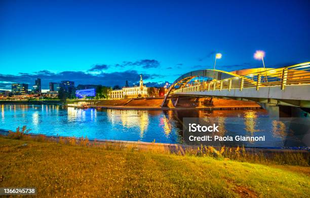 Illuminated Bridge Of Vilnius Along Neris River Lithuania Stock Photo - Download Image Now