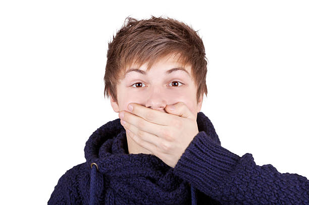 istock Boy Shut His Mouth With One Hand 136624672