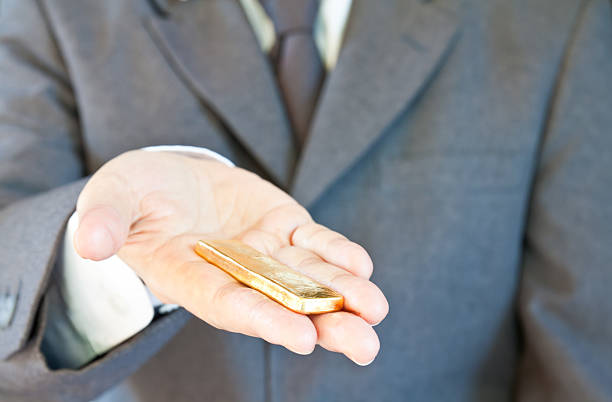 Business man with gold bar stock photo