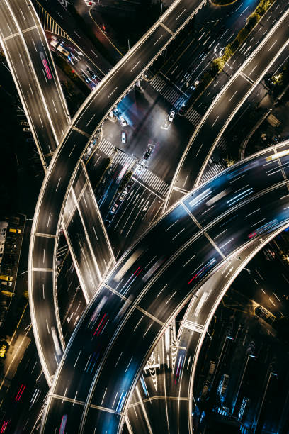 istock Drone Point View of Overpass and City Traffic at Night 1366248238